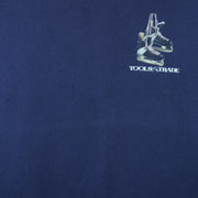 2001 vintage Tools of the Trade Hockey T-Shirt by Gildan. Blue in color with small image on front and large printed art on back by Jim Baldwin, fits X-Large in size and is in excellent condition.