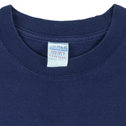 2001 vintage Tools of the Trade Hockey T-Shirt by Gildan. Blue in color with small image on front and large printed art on back by Jim Baldwin, fits X-Large in size and is in excellent condition.