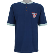 1999 vintage MLB New York Yankees embroidered T-Shirt by Pro Edge, Genuine Merchandise. Blue in color with three buttons at collar and grey trim, fits Medium to Large in size and is in excellent condition.