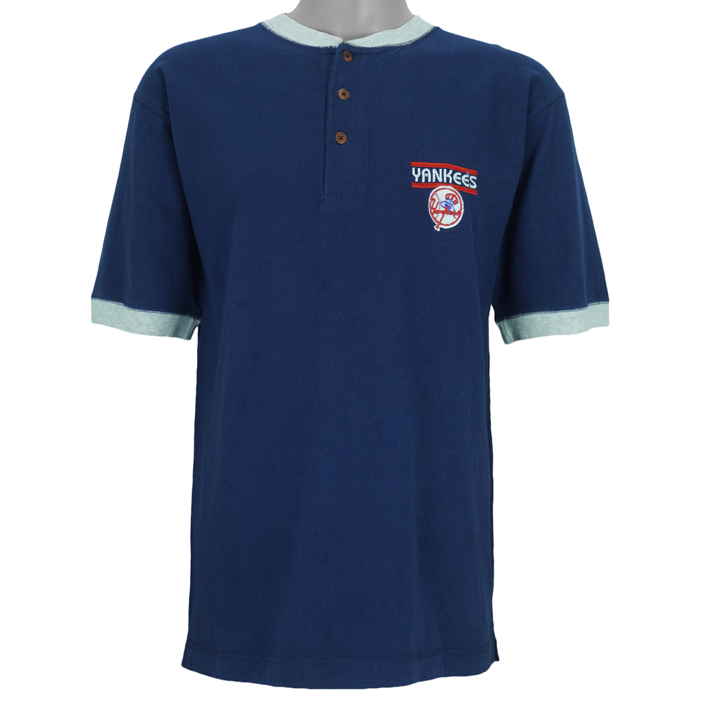 1999 vintage MLB New York Yankees embroidered T-Shirt by Pro Edge, Genuine Merchandise. Blue in color with three buttons at collar and grey trim, fits Medium to Large in size and is in excellent condition.