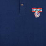 1999 vintage MLB New York Yankees embroidered T-Shirt by Pro Edge, Genuine Merchandise. Blue in color with three buttons at collar and grey trim, fits Medium to Large in size and is in excellent condition.