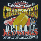 1998 vintage NHL Detroit Red Wings Stanley Cup Champions 97-98 T-Shirt by Logo 7. Black in color with big printed graphic and spell-out on front: Cup 2 Cup, Nine for All Time. Large in size and is in excellent condition.