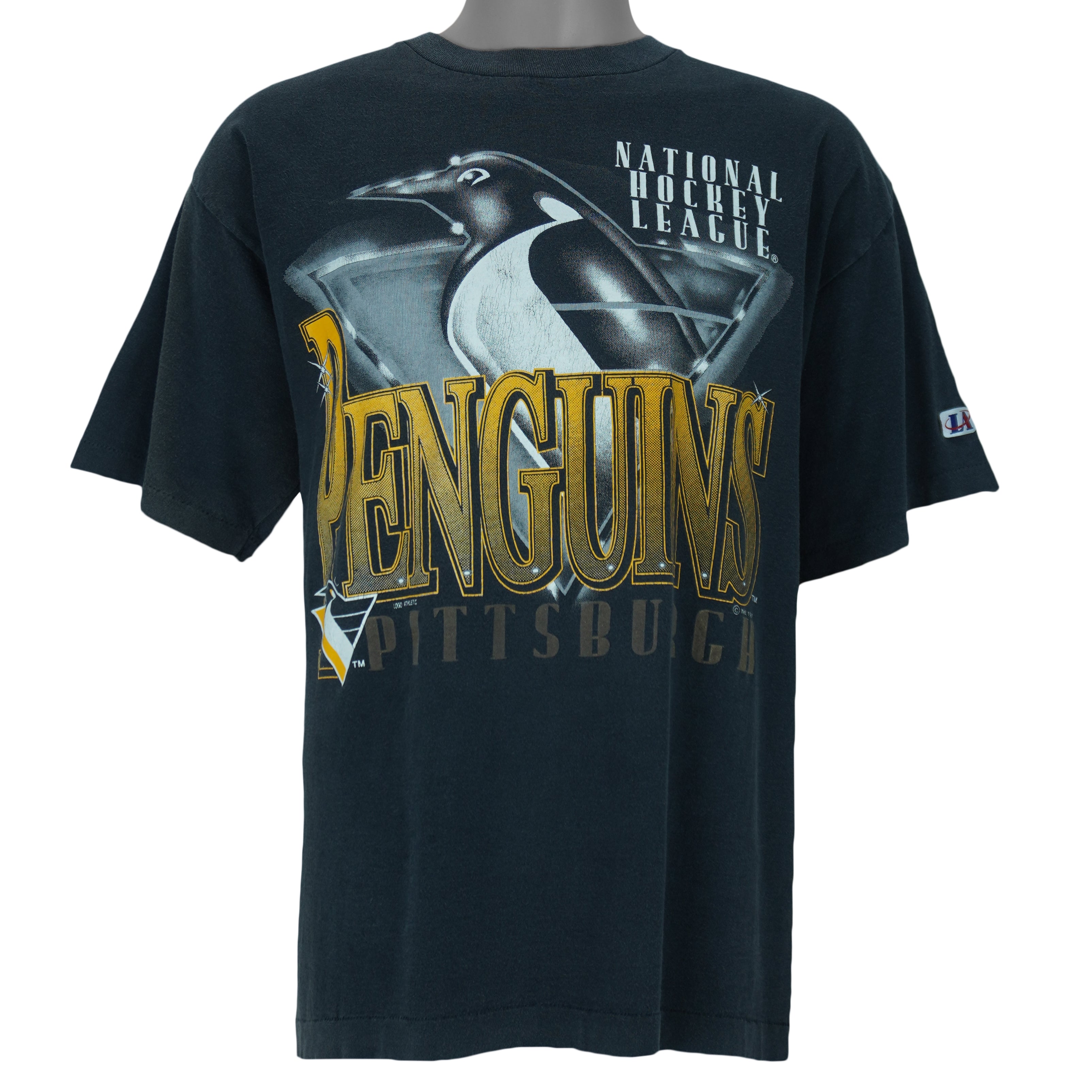 1993 vintage NHL Pittsburgh Penguins T-Shirt by Logo Athletic. Black in color with big spell-out and big chrome-style logo graphic on front, Large in size and is in excellent condition.