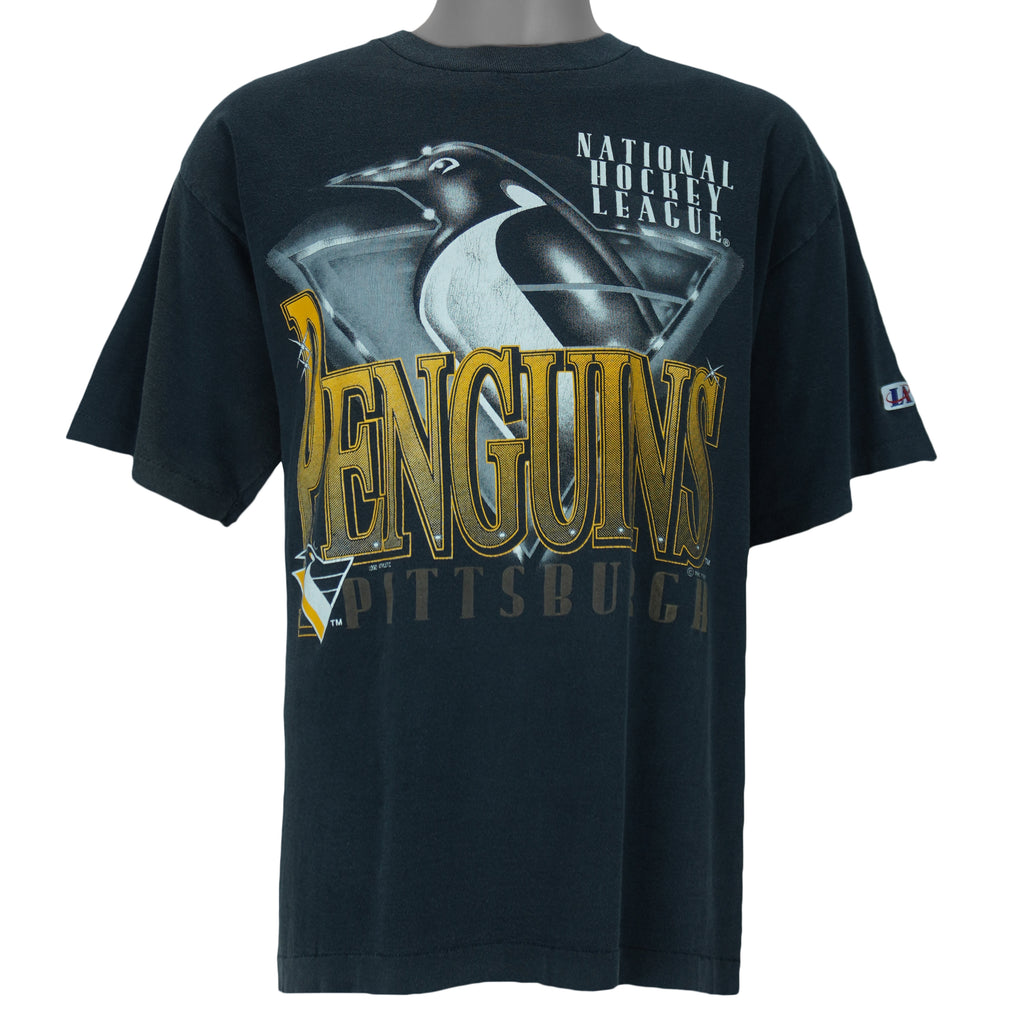 1993 vintage NHL Pittsburgh Penguins T-Shirt by Logo Athletic. Black in color with big spell-out and big chrome-style logo graphic on front, Large in size and is in excellent condition.
