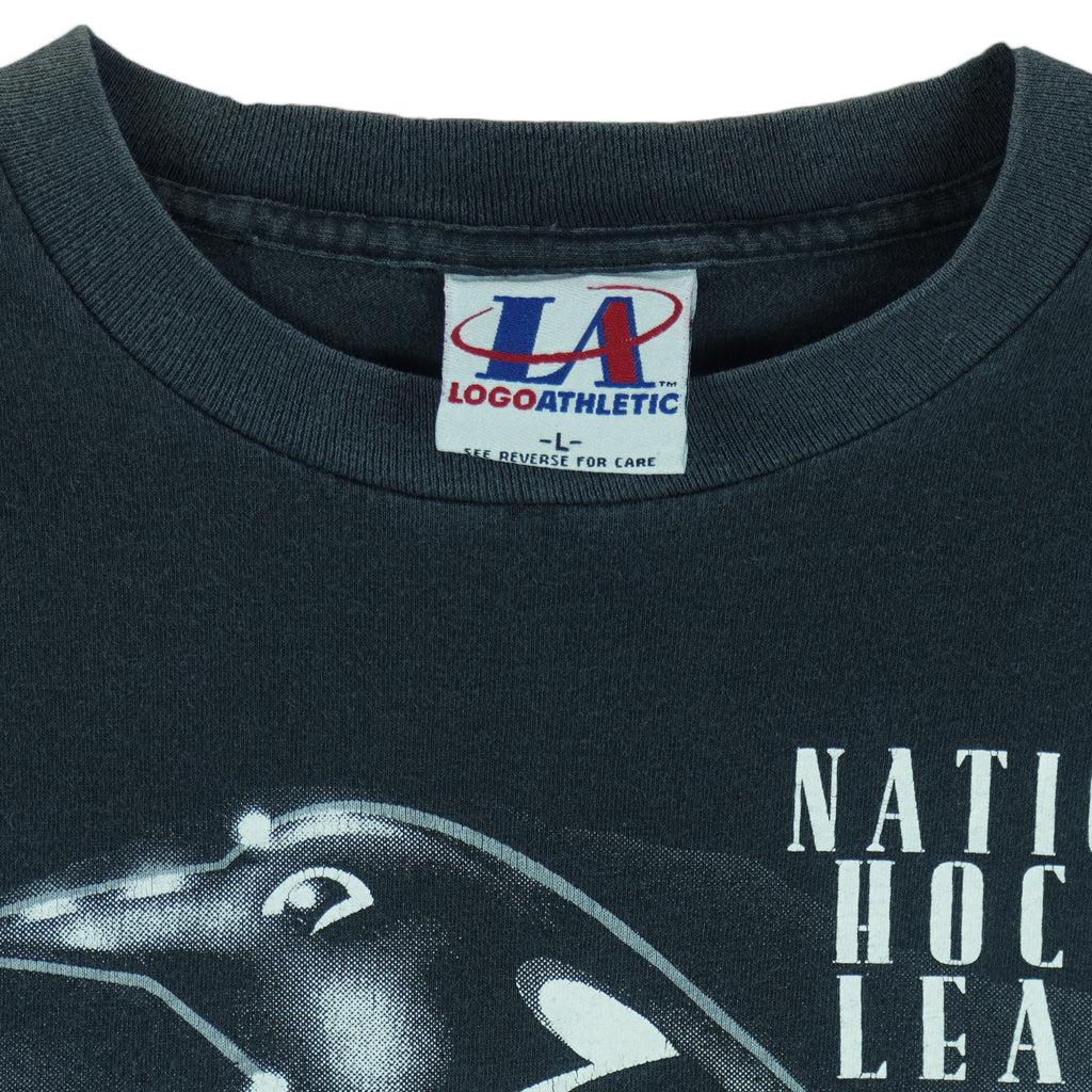 1993 vintage NHL Pittsburgh Penguins T-Shirt by Logo Athletic. Black in color with big spell-out and big chrome-style logo graphic on front, Large in size and is in excellent condition.