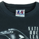 1993 vintage NHL Pittsburgh Penguins T-Shirt by Logo Athletic. Black in color with big spell-out and big chrome-style logo graphic on front, Large in size and is in excellent condition.