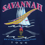 1996 vintage Atlanta Olympic Games Yachting T-Shirt by Hanes. Blue in color with "Site of 1996 Olympic Yachting Events" and "Savannah" spell-outs, Large in size and is in excellent condition.