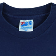 1996 vintage Atlanta Olympic Games Yachting T-Shirt by Hanes. Blue in color with "Site of 1996 Olympic Yachting Events" and "Savannah" spell-outs, Large in size and is in excellent condition.