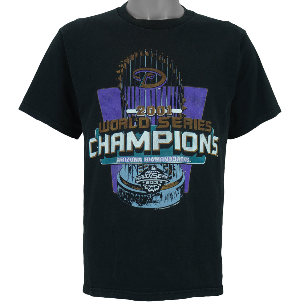 2001 vintage MLB Arizona Diamondbacks World Series Champions T-Shirt by Lee Sport. Black in color with spell-out and trophy graphic by Imagewear on front. Medium in size and is in excellent condition.