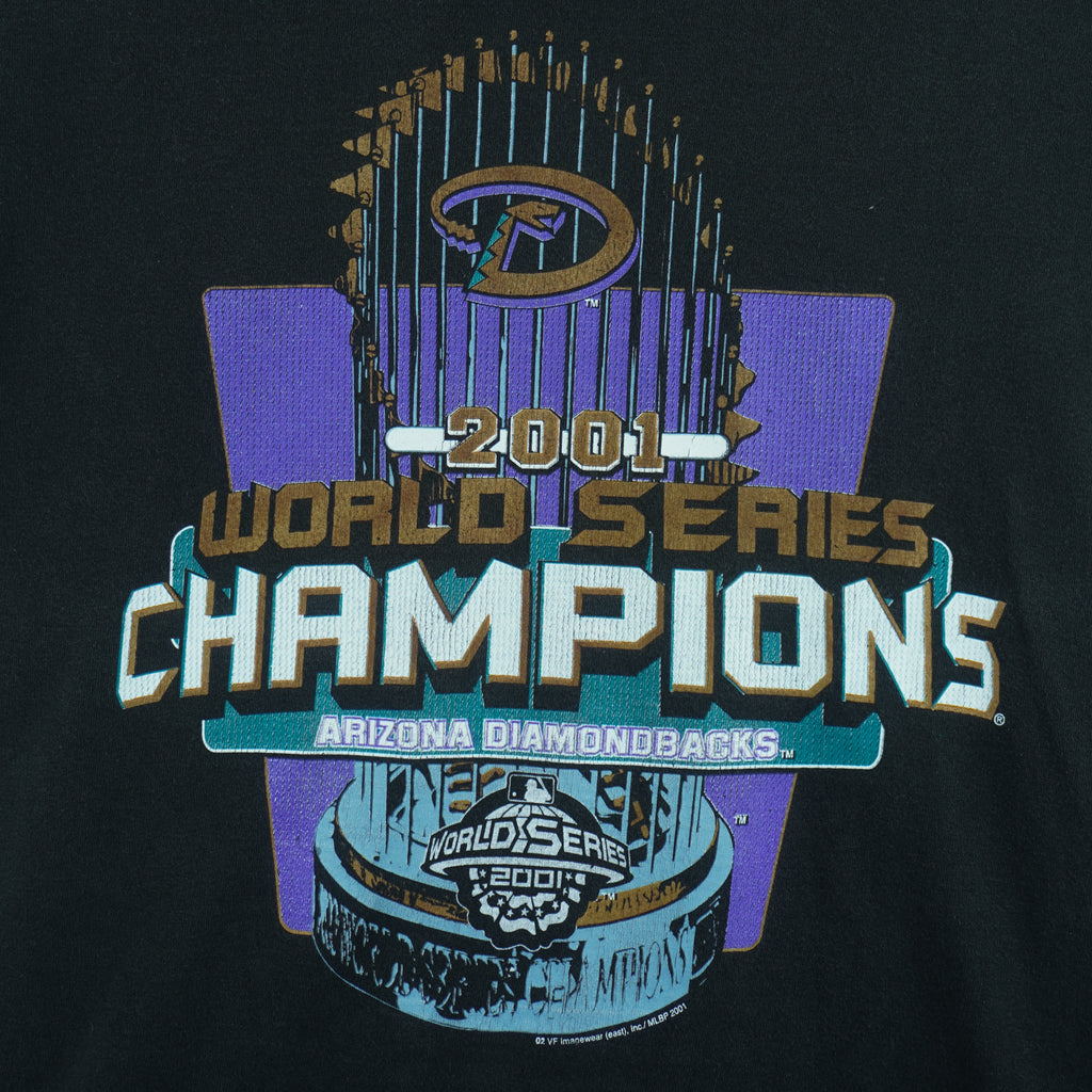 2001 vintage MLB Arizona Diamondbacks World Series Champions T-Shirt by Lee Sport. Black in color with spell-out and trophy graphic by Imagewear on front. Medium in size and is in excellent condition.
