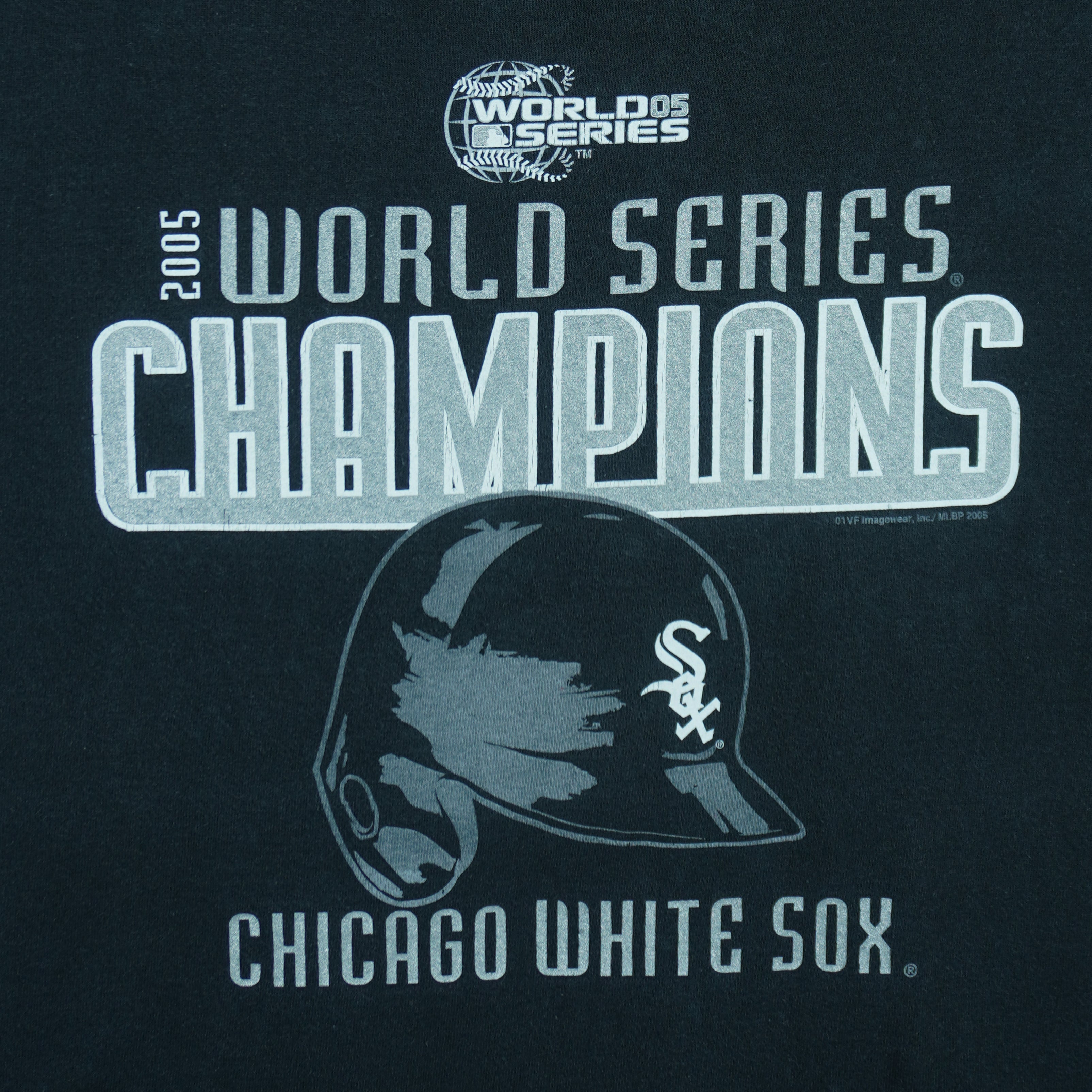 2005 vintage MLB Chicago White Sox World Series Champions spell-out T-Shirt by CSA. Black in color with helmet and team logo on front, Medium in size and is in excellent condition.