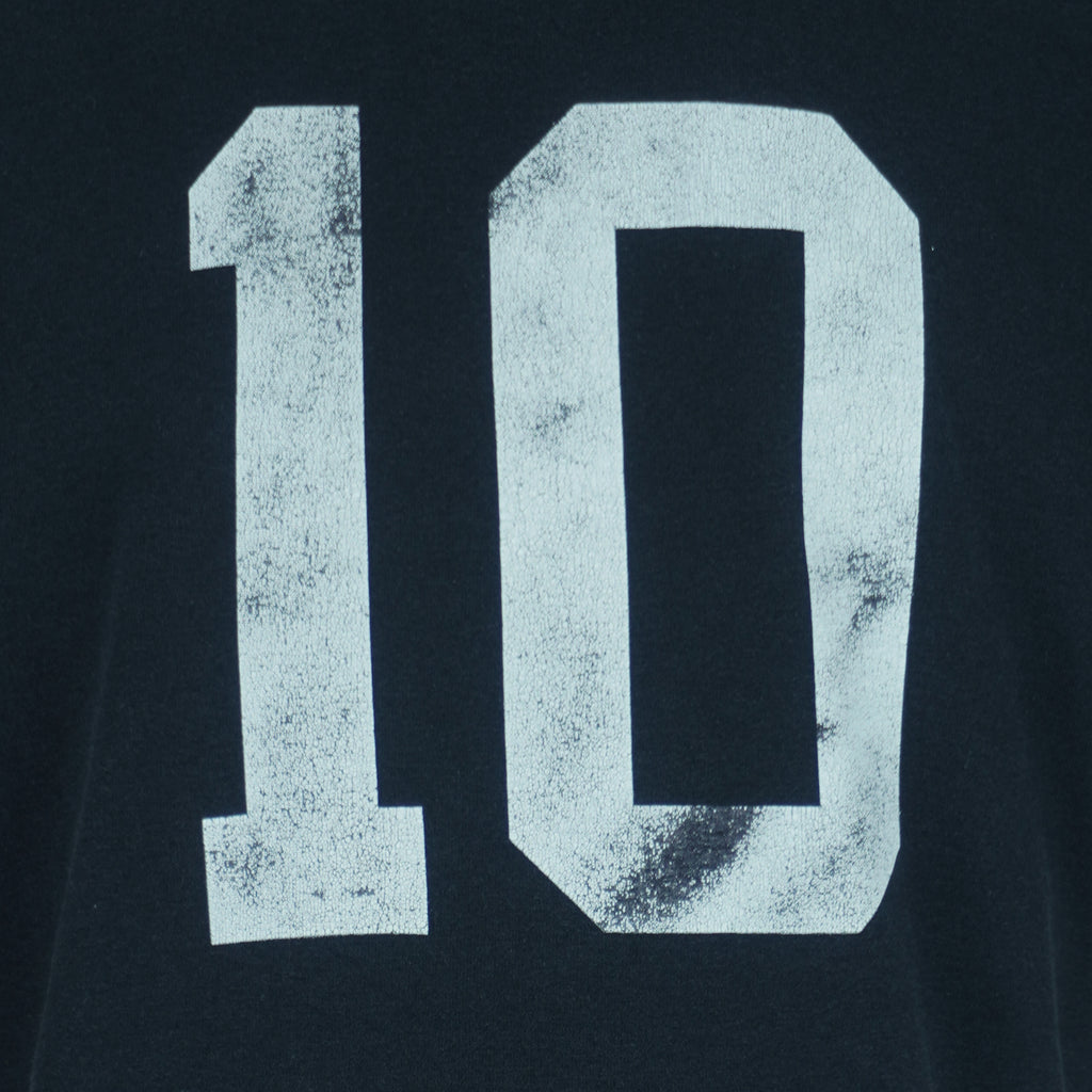 1990s vintage MLB Chicago White Sox button-collar T-Shirt by Majestic - Genuine Merchandise. Black in color with big logo on front, #10 on back, Majestic logo on right sleeve and Qdoba Mexican Grill logo on left sleeve, medium in size and is in very good condition.