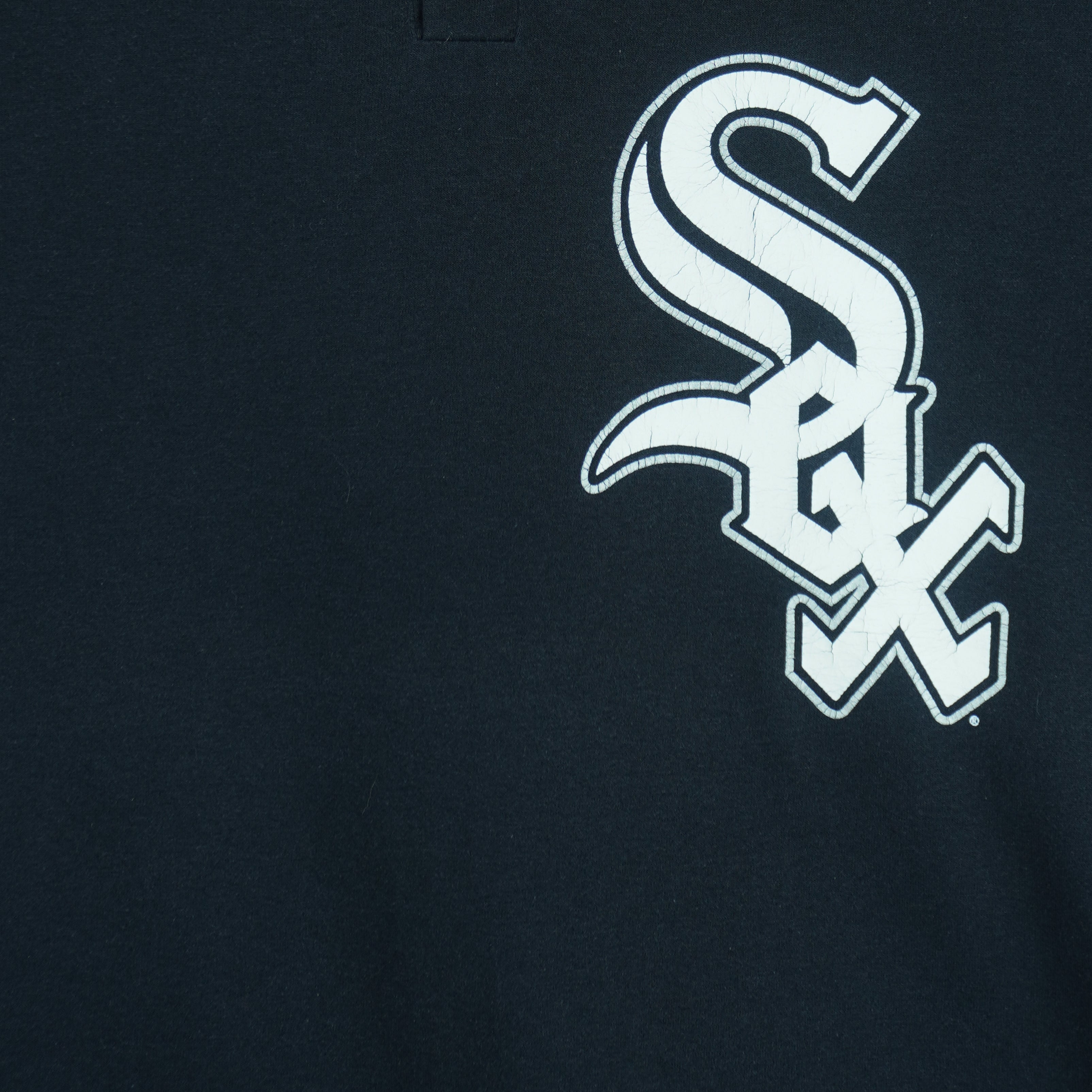 1990s vintage MLB Chicago White Sox button-collar T-Shirt by Majestic - Genuine Merchandise. Black in color with big logo on front, #10 on back, Majestic logo on right sleeve and Qdoba Mexican Grill logo on left sleeve, medium in size and is in very good condition.