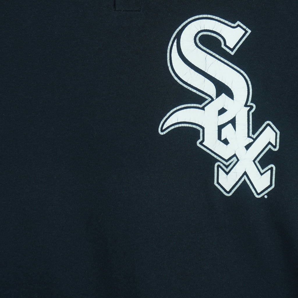 1990s vintage MLB Chicago White Sox button-collar T-Shirt by Majestic - Genuine Merchandise. Black in color with big logo on front, #10 on back, Majestic logo on right sleeve and Qdoba Mexican Grill logo on left sleeve, medium in size and is in very good condition.