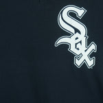 1990s vintage MLB Chicago White Sox button-collar T-Shirt by Majestic - Genuine Merchandise. Black in color with big logo on front, #10 on back, Majestic logo on right sleeve and Qdoba Mexican Grill logo on left sleeve, medium in size and is in very good condition.