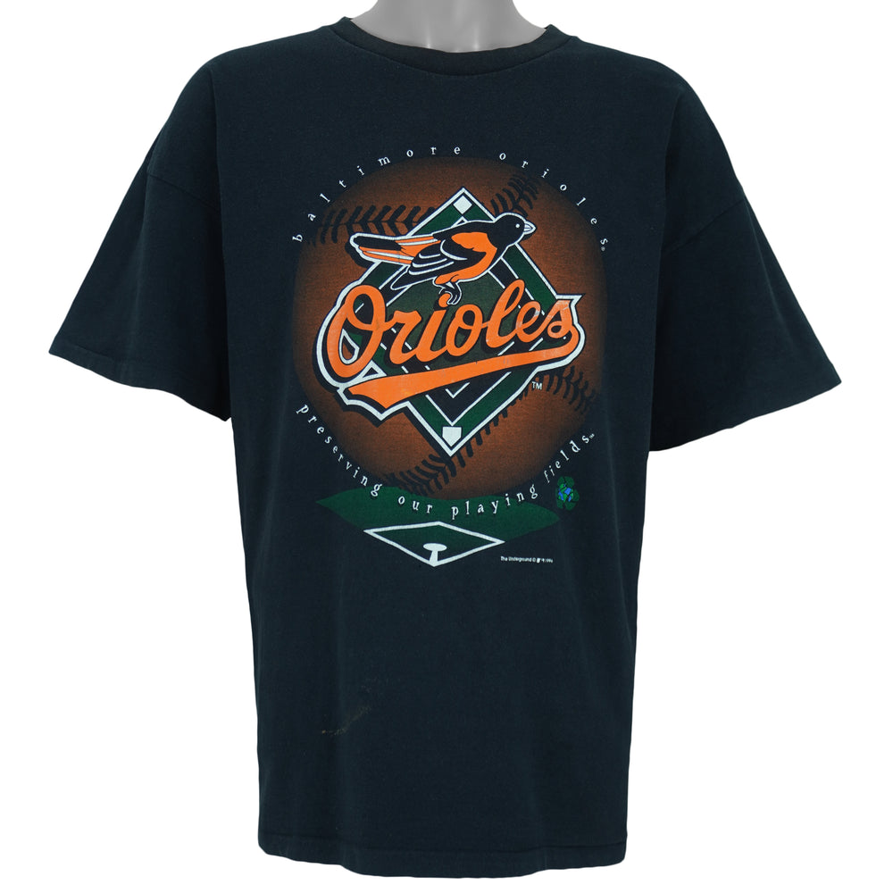 1996 vintage MLB Baltimore Orioles big-logo recycled material T-Shirt by Underground Athletic. Black in color with "Preserving our playing fields" text on front, XX-Large in size and is in excellent condition.