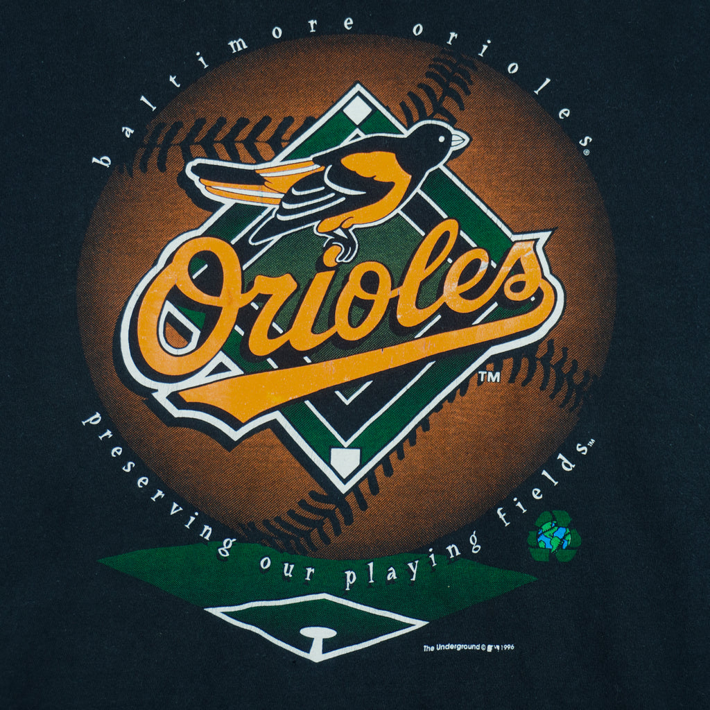 1996 vintage MLB Baltimore Orioles big-logo recycled material T-Shirt by Underground Athletic. Black in color with "Preserving our playing fields" text on front, XX-Large in size and is in excellent condition.