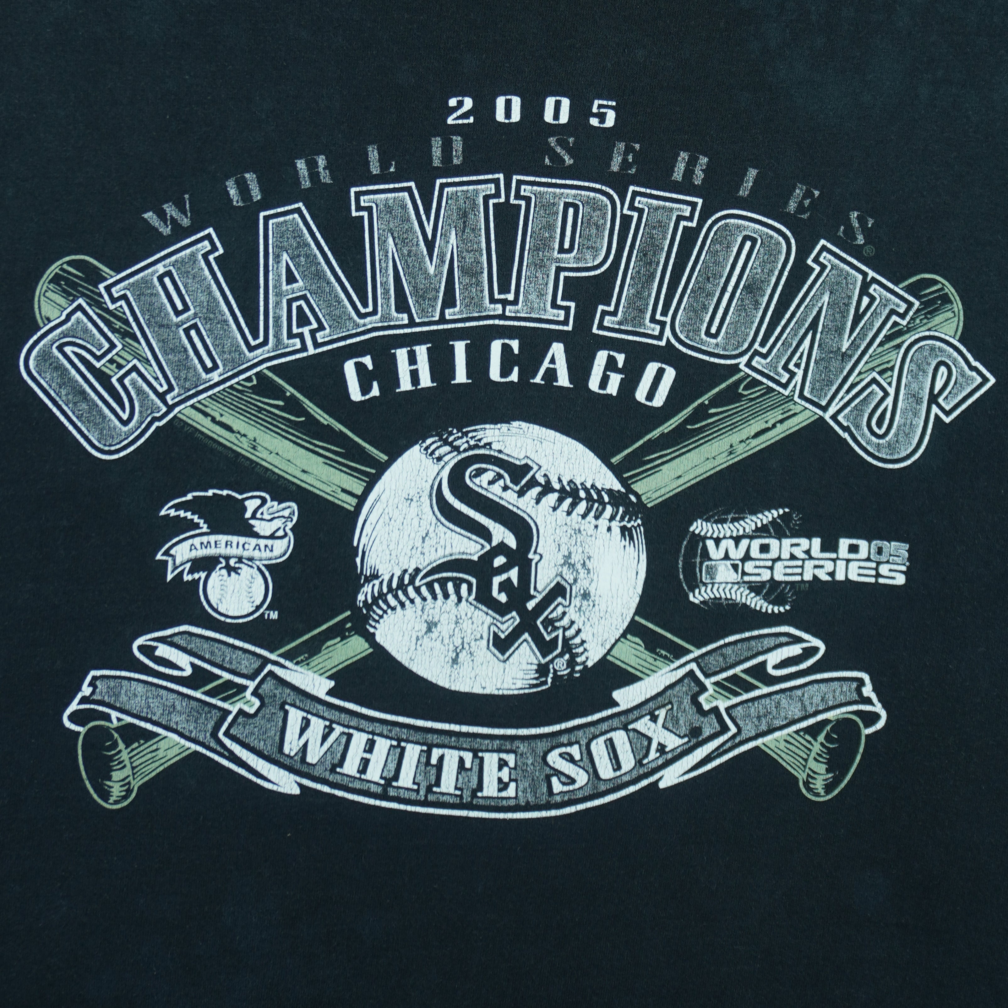 2005 vintage MLB Chicago White Sox World Series Champions spell-out T-Shirt by CSA. Black in color with crossed baseball bats and and team logo on front, Large in size and is in excellent condition.