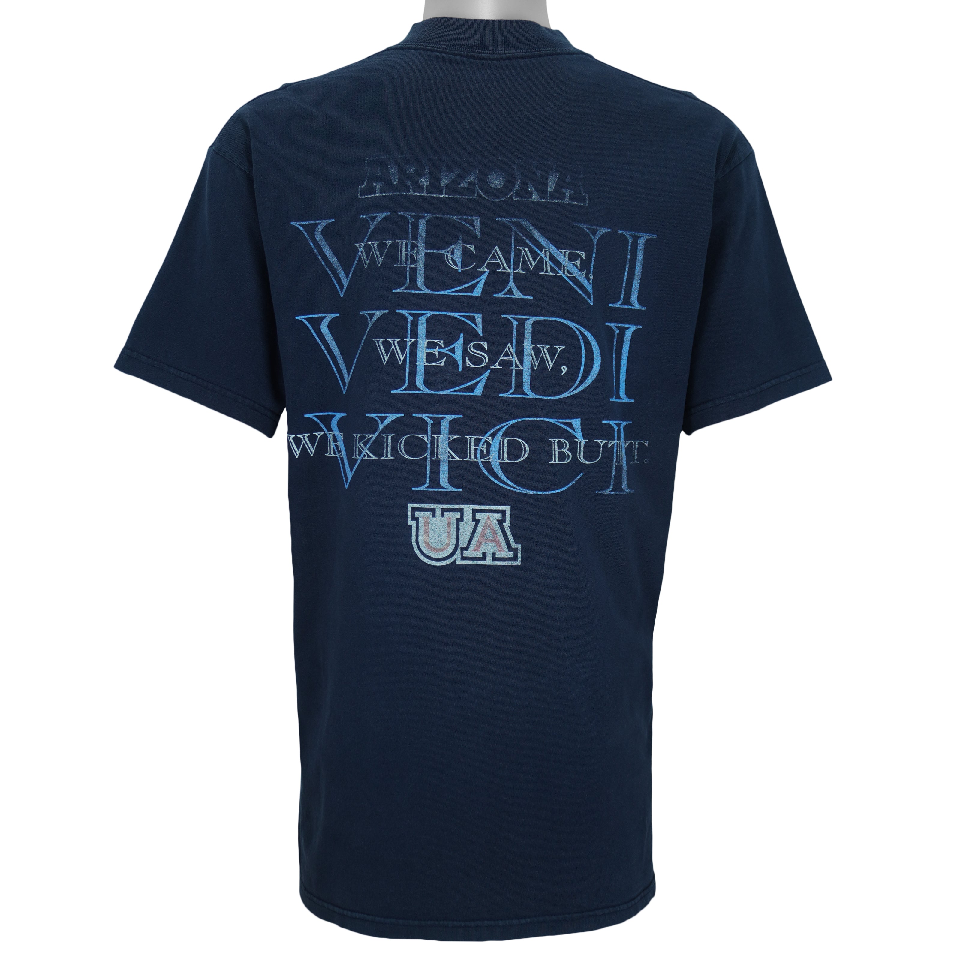 2000s vintage NCAA University of Arizona Wildcats football helmet T-Shirt. Dark blue in color with "Absolute Victory" spell-out on front and "We Came, We Saw, We Kicked Butt" on back. Fits Medium in size and in excellent condition.