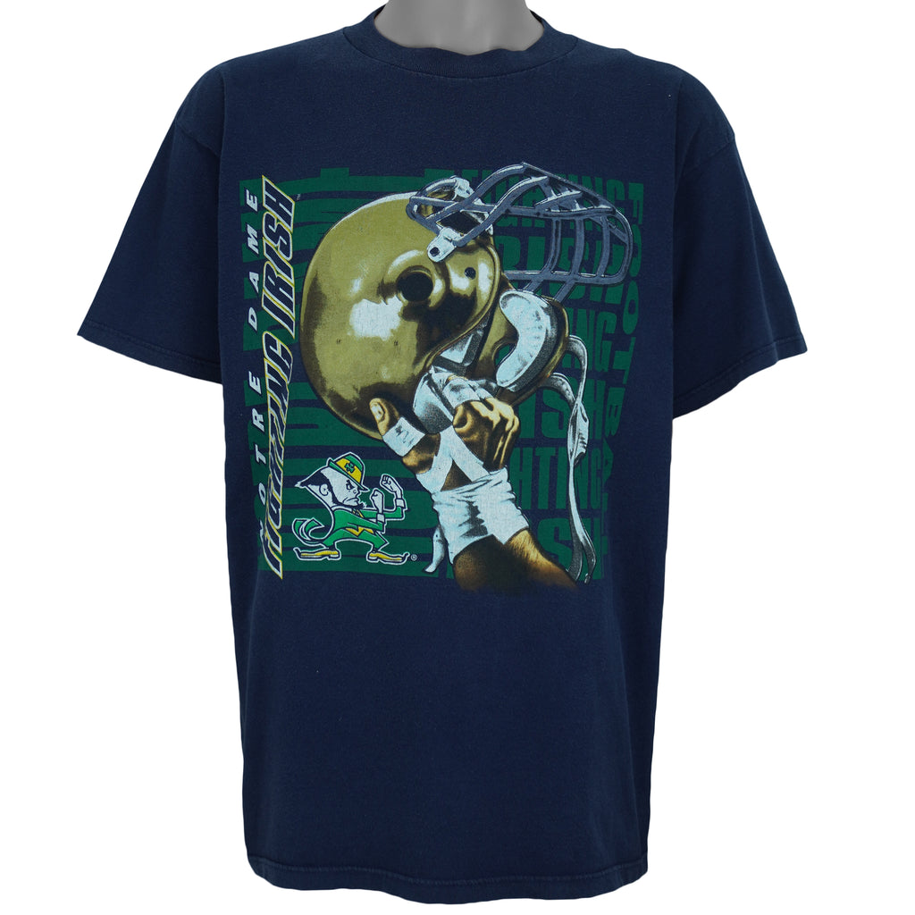 1990s vintage NCAA University of Notre Dame Fighting Irish helmet T-Shirt by Logo 7. Blue in color, X-Large in size and is in excellent condition.
