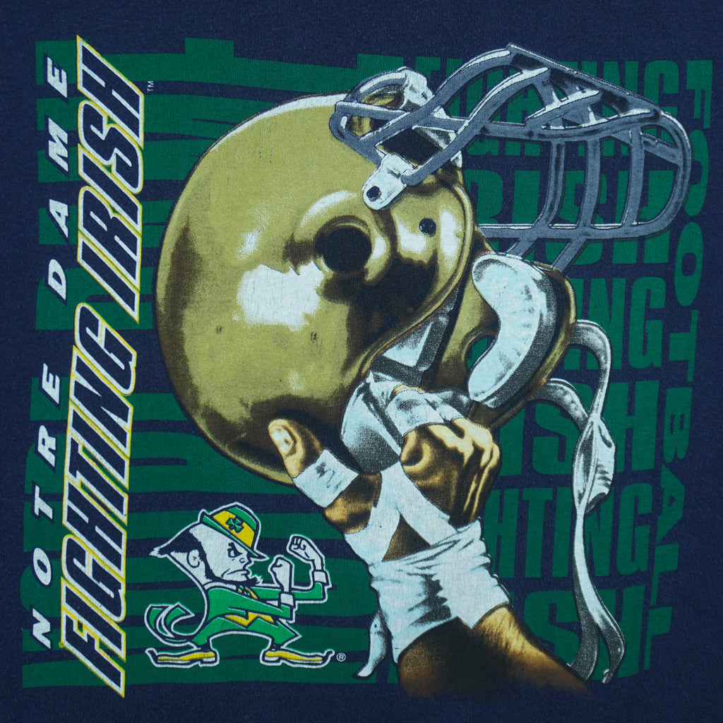 1990s vintage NCAA University of Notre Dame Fighting Irish helmet T-Shirt by Logo 7. Blue in color, X-Large in size and is in excellent condition.