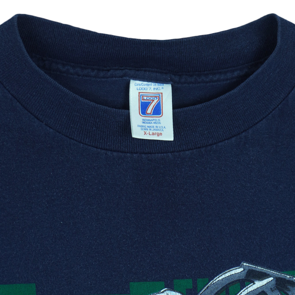 1990s vintage NCAA University of Notre Dame Fighting Irish helmet T-Shirt by Logo 7. Blue in color, X-Large in size and is in excellent condition.