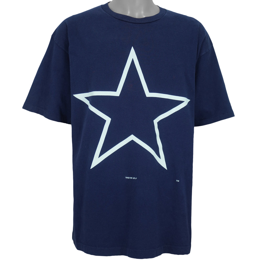 1995 vintage NFL Dallas Cowboys T-shirt by Logo 7. Dark blue in color with large star logo on front, fits X-Large in size and in excellent condition.