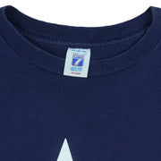 1995 vintage NFL Dallas Cowboys T-shirt by Logo 7. Dark blue in color with large star logo on front, fits X-Large in size and in excellent condition.