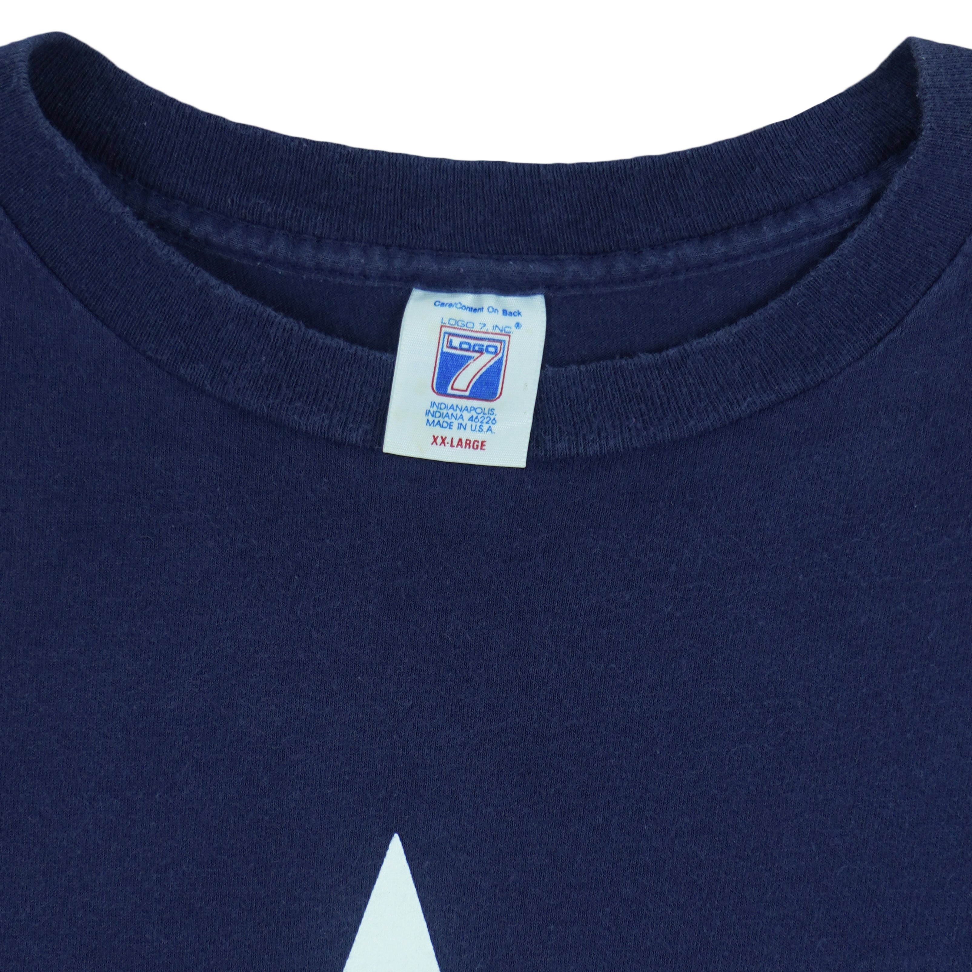 1995 vintage NFL Dallas Cowboys T-shirt by Logo 7. Dark blue in color with large star logo on front, fits X-Large in size and in excellent condition.