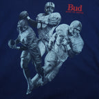 1990s vintage Budweiser single stitch T-Shirt by Hanes Beefy-T. Blue in color with three players and "Bud, King of Beers" small spell-out on front, X-Large in size and is in excellent condition.