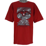 2004 vintage NCAA University of Nebraska-Lincoln Cornhuskers spell-out Gildan T-Shirt. Red in color with "Rise of the Machine, West Coast Offense" text and football player graphic on front by Art-Fx Collectors Edition. X-Large in size and in excellent condition.