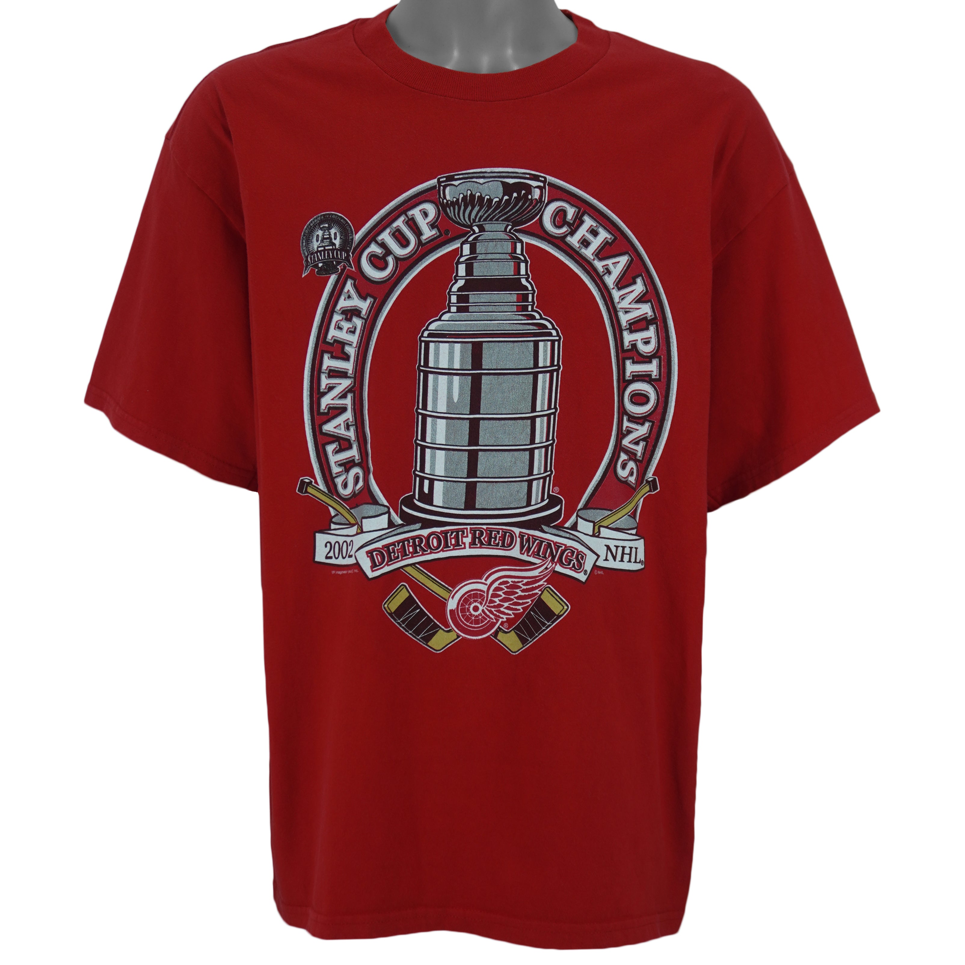 2002 vintage NHL Detroit Red Wings Stanley Cup Champions Big Logo T-Shirt by CSA. Red in color with spell-out and trophy graphic on front by VF Imagewear. Fits Large in size and in excellent condition.
