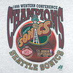 1996 vintage NBA Seattle Supersonics Western Conference Champs T-Shirt by Oneita. White in color with big spell-out and logo. X-Large in size and is in excellent condition.