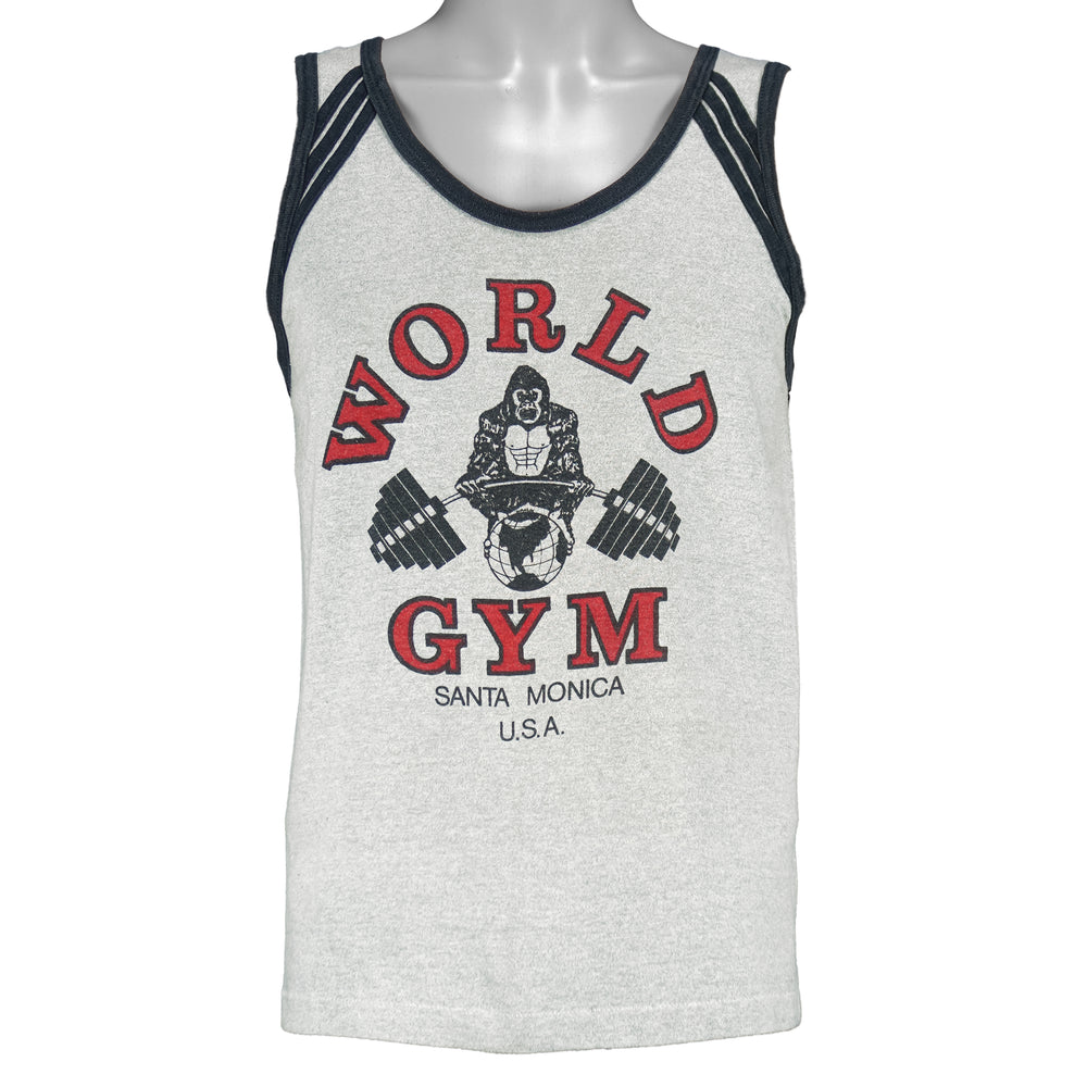 1990s vintage World Gym, Santa Monica USA sleeveless workout shirt. Grey in color with black trim, has a big printed graphic of the gorilla logo on front and back, fits Medium in size, and is in excellent condition.