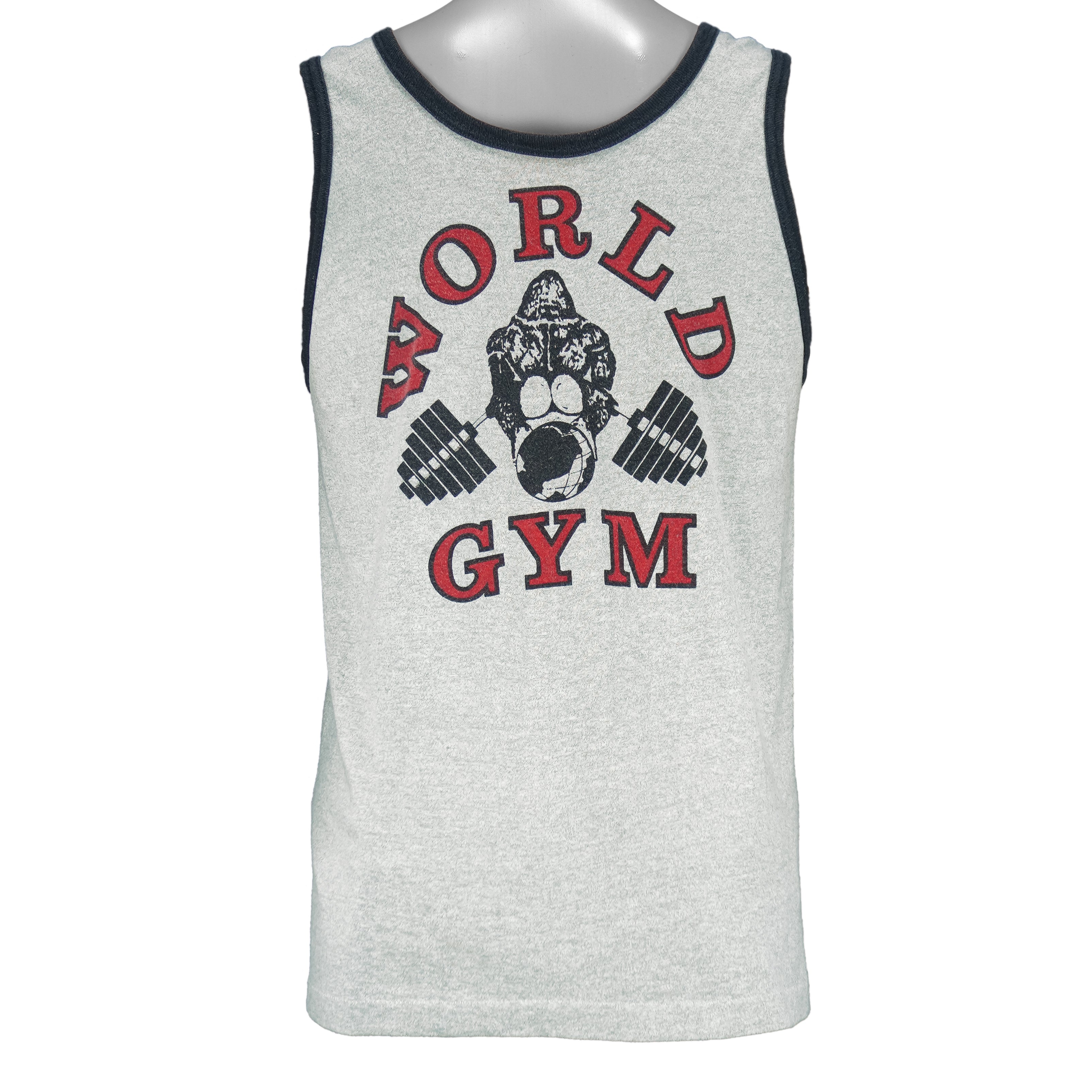 1990s vintage World Gym, Santa Monica USA sleeveless workout shirt. Grey in color with black trim, has a big printed graphic of the gorilla logo on front and back, fits Medium in size, and is in excellent condition.