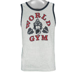 1990s vintage World Gym, Santa Monica USA sleeveless workout shirt. Grey in color with black trim, has a big printed graphic of the gorilla logo on front and back, fits Medium in size, and is in excellent condition.