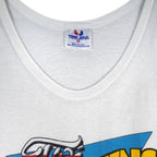 1988 vintage Looney Tunes Taz's Wrecking Service sleeveless shirt by Tee Jays. White in color with big printed graphic of the Tazmanian Devil in a tow truck, tagged size Medium, and is in excellent condition.