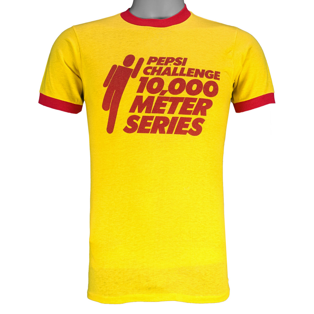1980s vintage Pepsi Challenge: 10,000 Meter Series ringer T-Shirt. Yellow in color with red trim, Campus Life spell-out on back, tagged size Medium and is in excellent condition.
