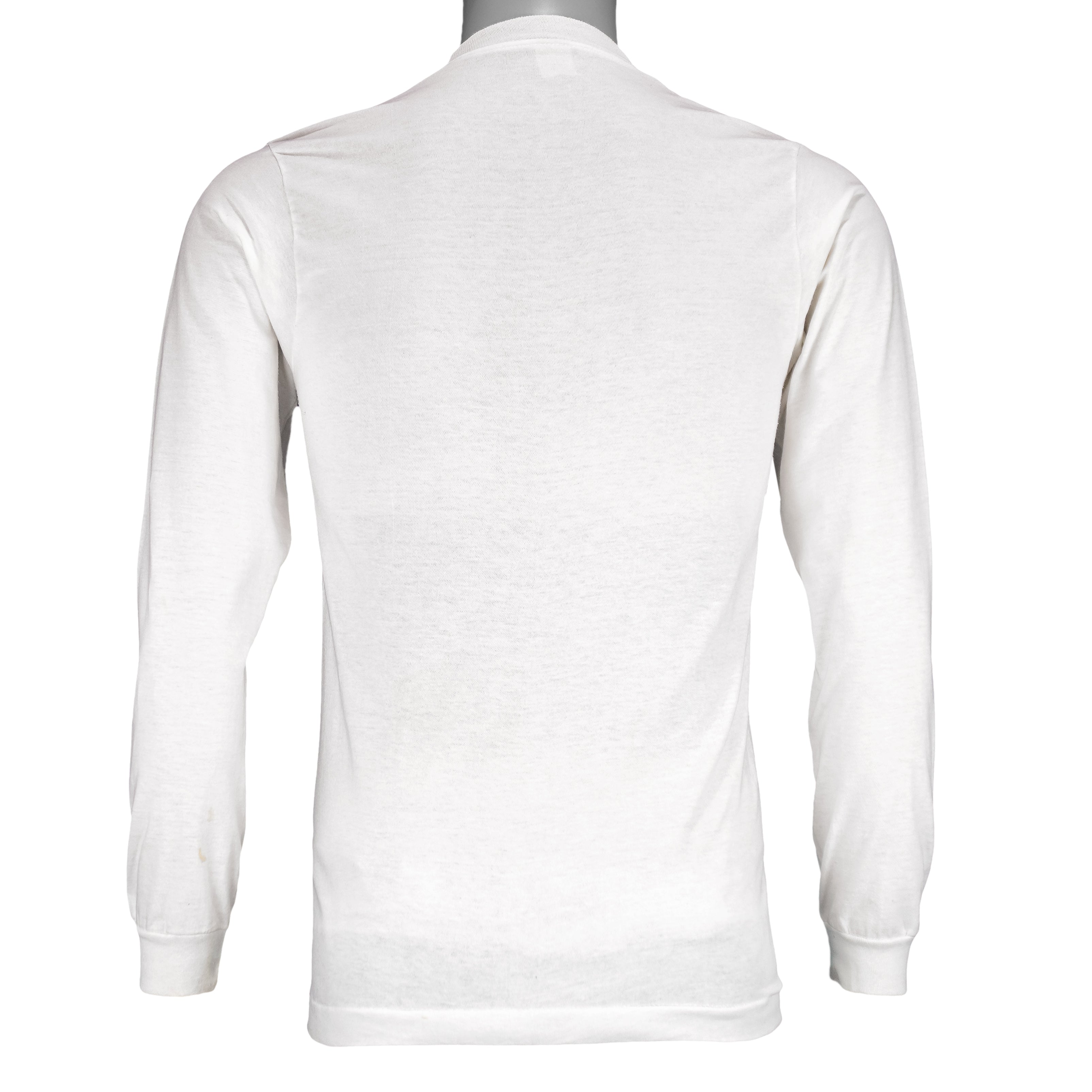 1987 vintage I Trained for the New York City Marathon Long Sleeve Shirt. White in color with original artwork by Kay Denmark on front, fits Small in size and is in excellent condition.