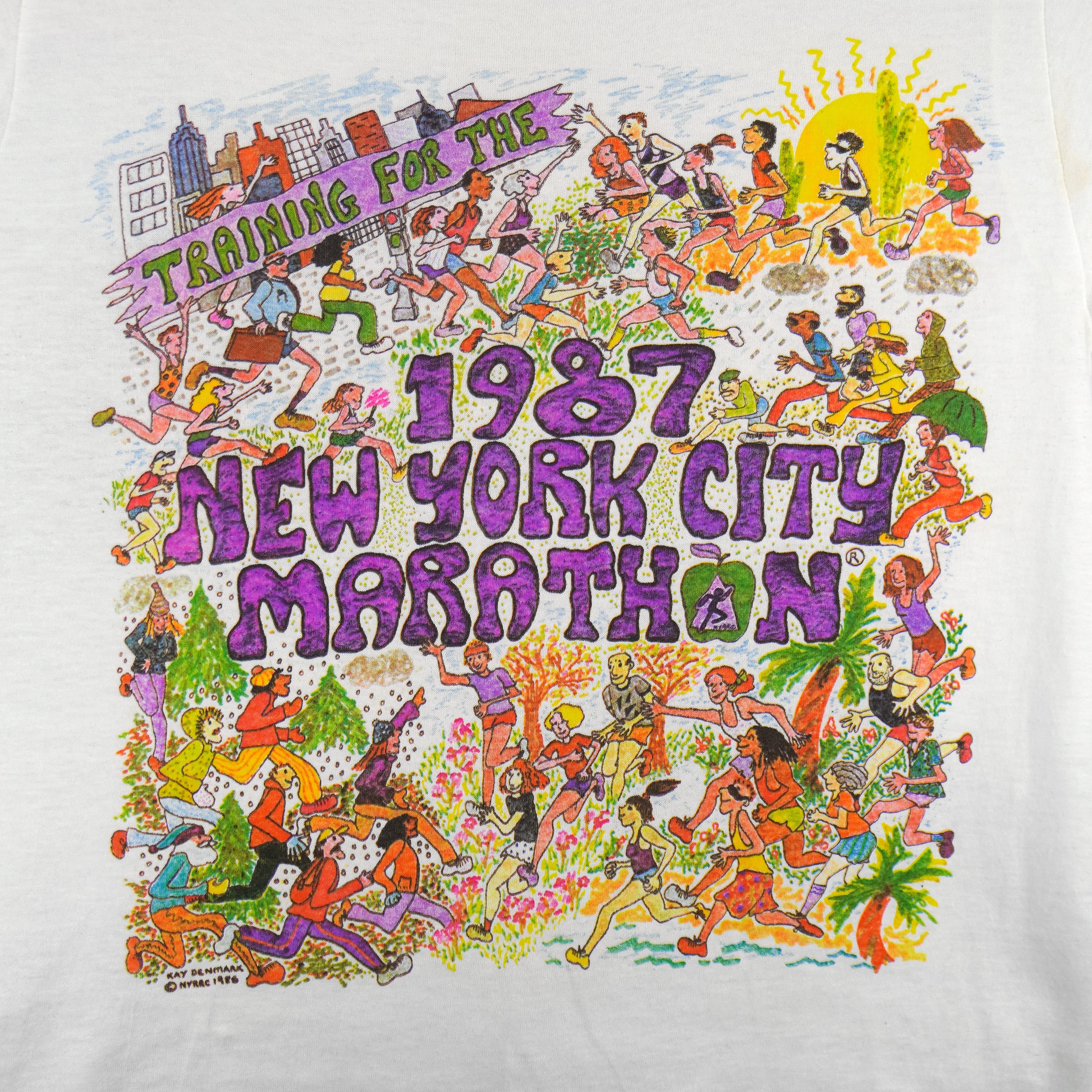 1987 vintage I Trained for the New York City Marathon Long Sleeve Shirt. White in color with original artwork by Kay Denmark on front, fits Small in size and is in excellent condition.