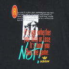 1990s vintage Adidas cheeky-motivational T-Shirt. Black in color with multiple text elements and small logo on front and large NOT spell-out on back, fits size Large and is in excellent condition.