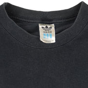 1990s vintage Adidas cheeky-motivational T-Shirt. Black in color with multiple text elements and small logo on front and large NOT spell-out on back, fits size Large and is in excellent condition.