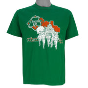 1988 vintage St. Patricks' Day 8K Run, March 13 in Saint Paul Minnesota, T-Shirt by Tee Jays. Green in color with runners and Irish clover on front and sponsors logos on back, tagged size Large and is in excellent condition.