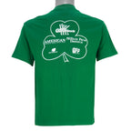 1988 vintage St. Patricks' Day 8K Run, March 13 in Saint Paul Minnesota, T-Shirt by Tee Jays. Green in color with runners and Irish clover on front and sponsors logos on back, tagged size Large and is in excellent condition.