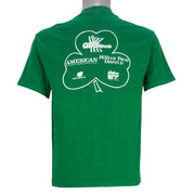 1988 vintage St. Patricks' Day 8K Run, March 13 in Saint Paul Minnesota, T-Shirt by Tee Jays. Green in color with runners and Irish clover on front and sponsors logos on back, tagged size Large and is in excellent condition.