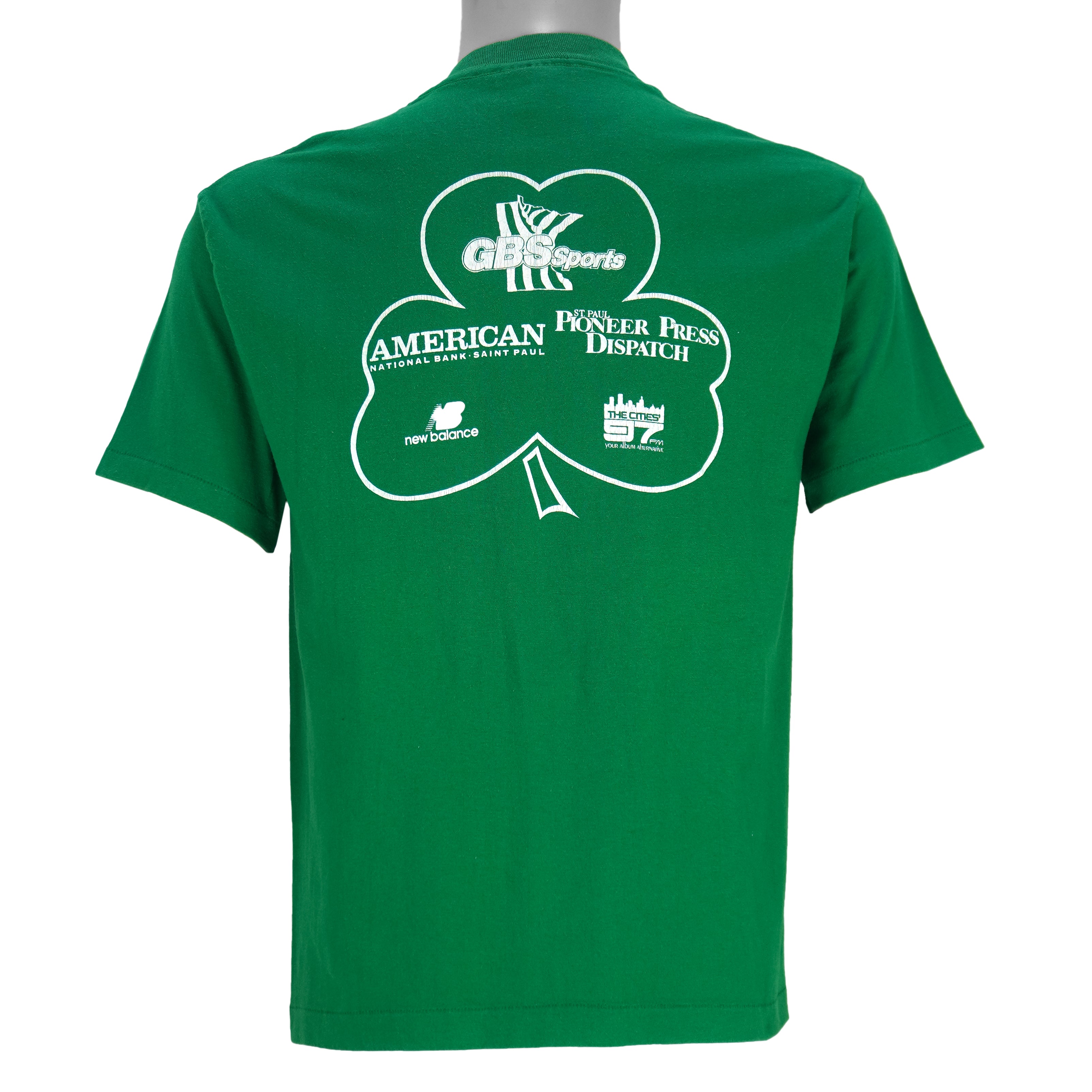 1988 vintage St. Patricks' Day 8K Run, March 13 in Saint Paul Minnesota, T-Shirt by Tee Jays. Green in color with runners and Irish clover on front and sponsors logos on back, tagged size Large and is in excellent condition.
