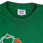 1988 vintage St. Patricks' Day 8K Run, March 13 in Saint Paul Minnesota, T-Shirt by Tee Jays. Green in color with runners and Irish clover on front and sponsors logos on back, tagged size Large and is in excellent condition.