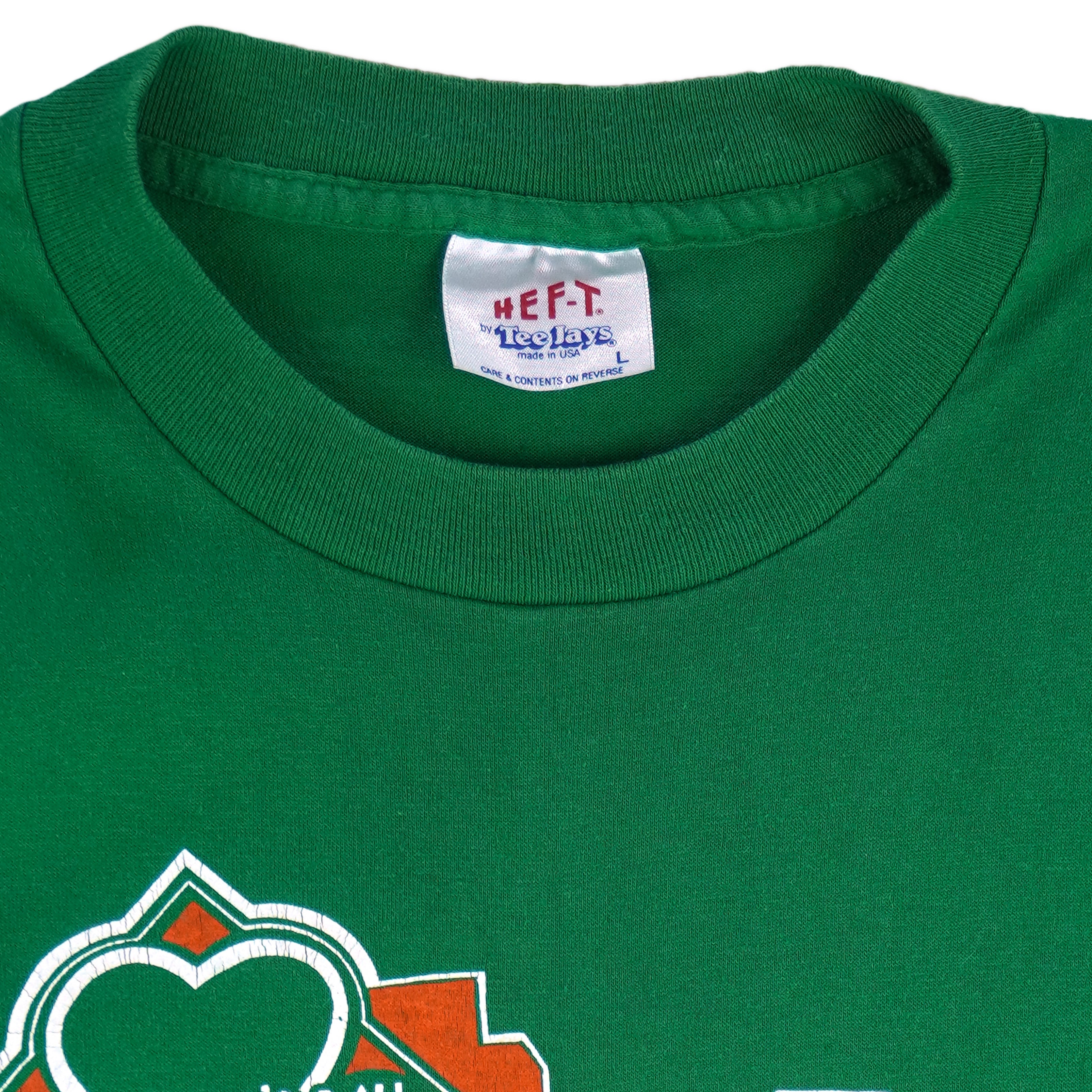1988 vintage St. Patricks' Day 8K Run, March 13 in Saint Paul Minnesota, T-Shirt by Tee Jays. Green in color with runners and Irish clover on front and sponsors logos on back, tagged size Large and is in excellent condition.