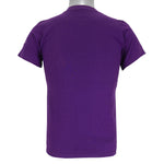 1991 vintage Bloomsday, Spokane Washington, Finisher T-Shirt by Jerzees. Purple in color with abstract people and skyline graphic printed on front and Nike insignia on left sleeve, tagged size Small and is in excellent condition.