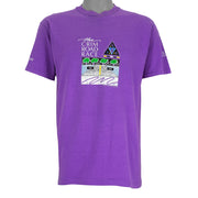 1988 vintage Flint Michigan 8 KM Crim Road Race T-Shirt by Hanes. Purple in color with printed&nbsp; graphics on front and back, tagged size Large and is in excellent condition.